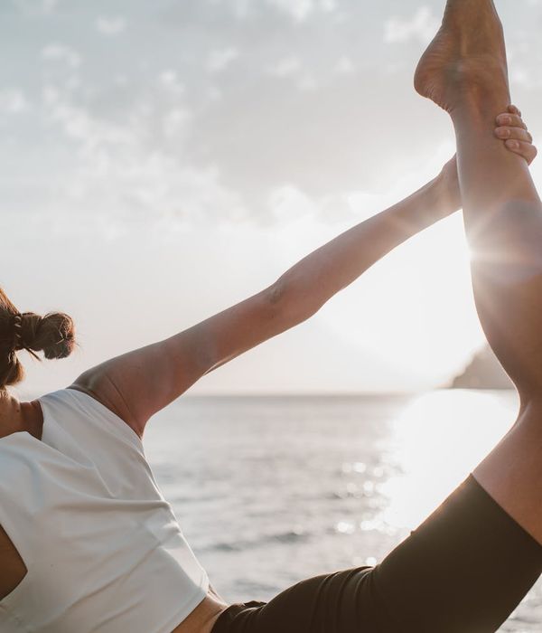 Woman in a calm yoga pose, embodying balance and posture.